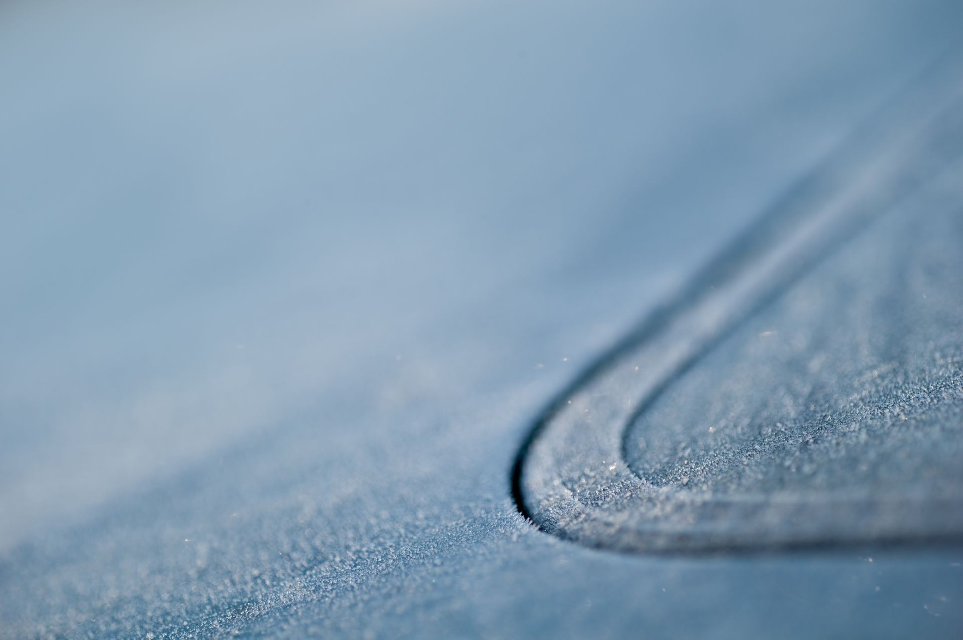 Frozen car window detail in winter close-up hoarfrost macro blue (high resolution medium format) concept car care maintenance season  with large copy space